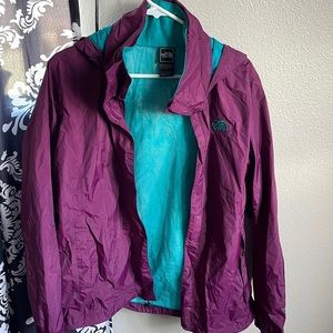 The north face windbreaker size women’s XL. Purple and teal. Has zipper pockets.